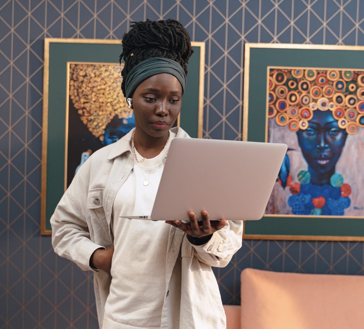 a woman holding a laptop