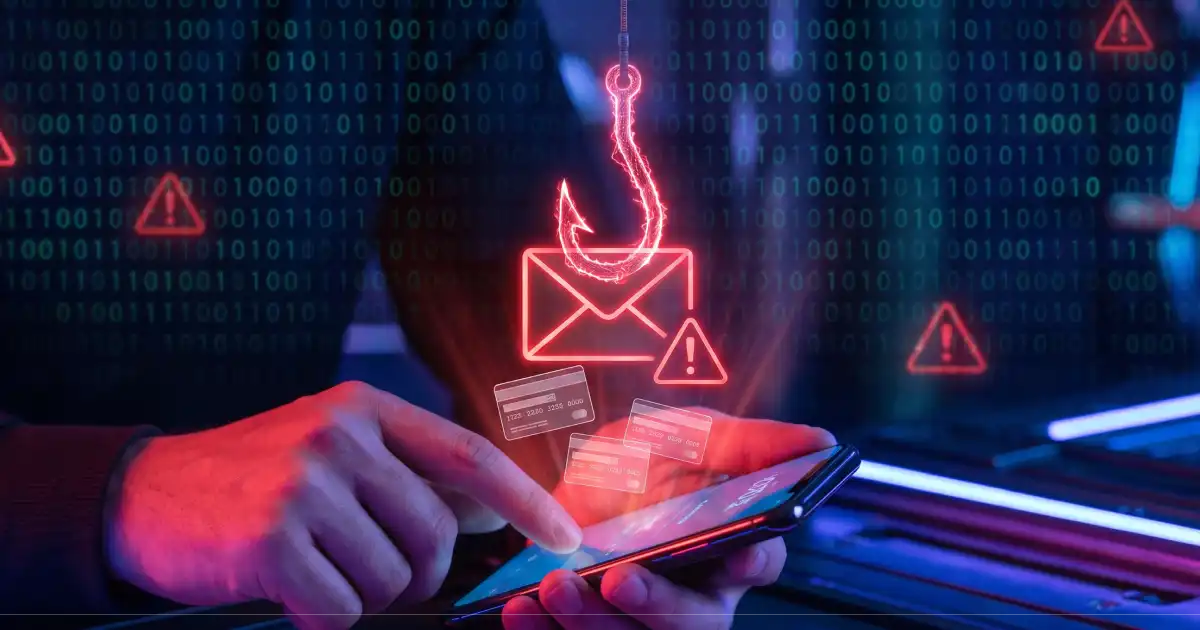 Person Holding A Phone With A Phishing Hook, Warning Icons, And Credit Cards In A Digital Environment