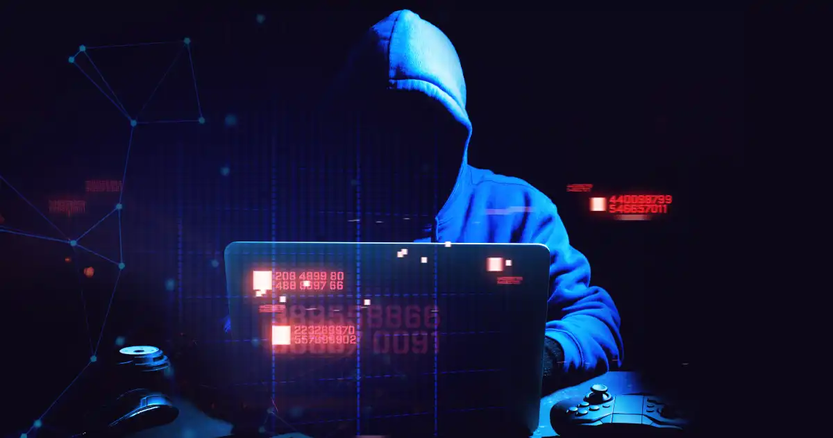 Hacker with code on a laptop